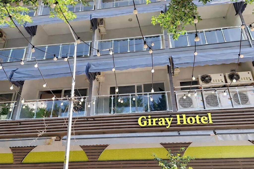 a city hotel with a sign on the side of a building at Giray Butik Hotel in Alanya