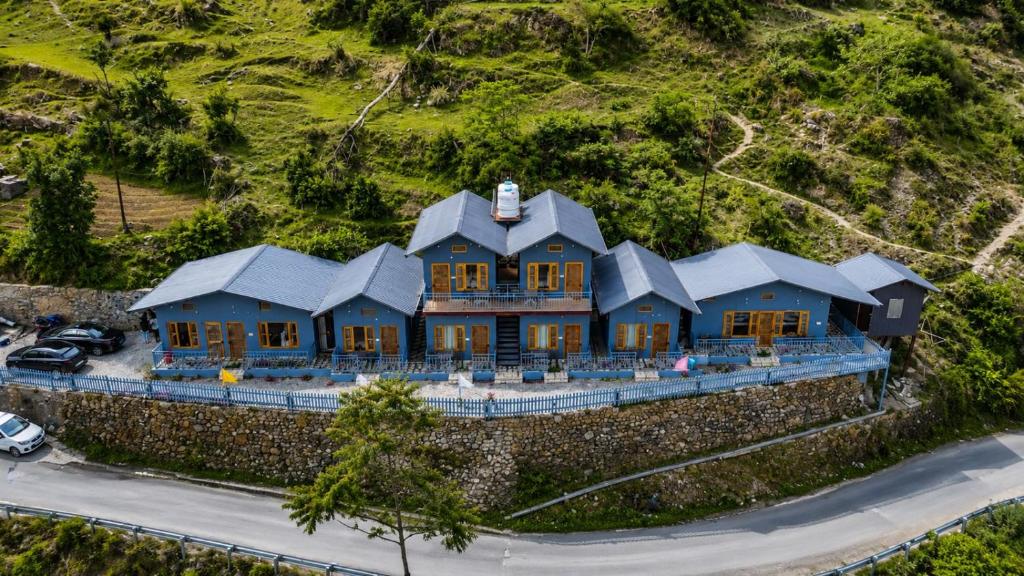 an aerial view of a house on a hill at Athiti Devo Bhava in Chakrāta