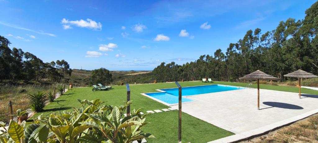 an image of a swimming pool in a yard at CCCA Monte Loureiro in Raposeira