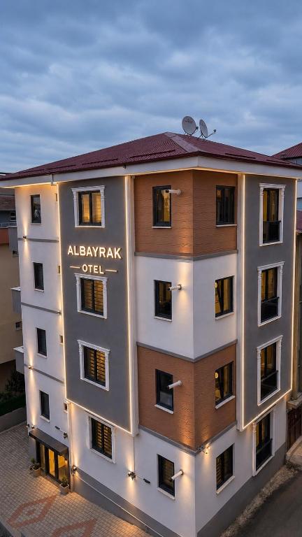 a apartment building with a sign on the side of it at Trabzon Albayrak Suite in Trabzon