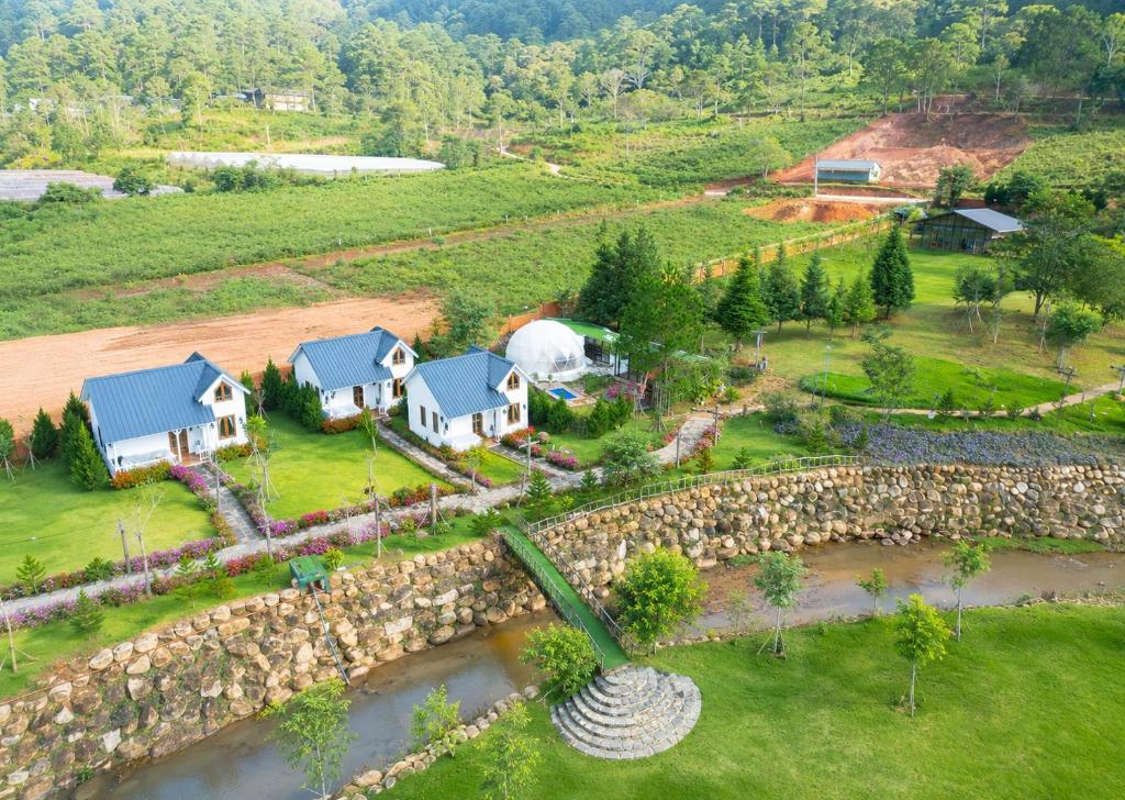 an aerial view of a house with a stone wall at Shanti Wellness Sanctuary Đà Lạt in Da Lat