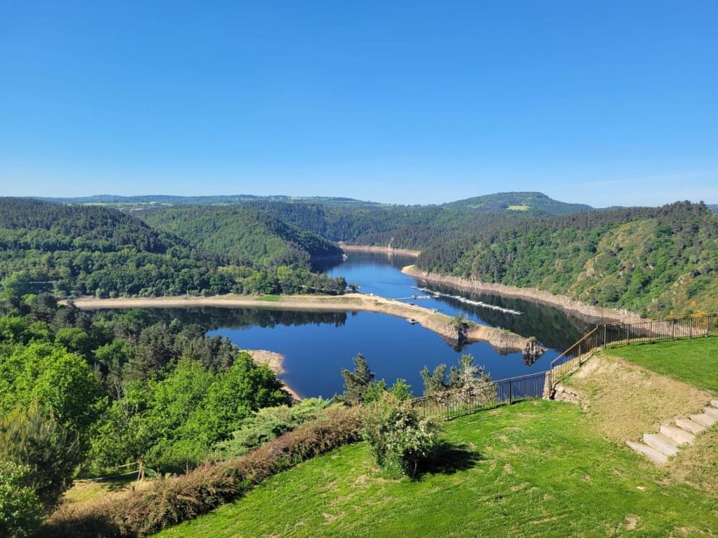 a view of a river with a bridge over it at Le Panoramic Garabit in Anglards-de-Saint-Flour