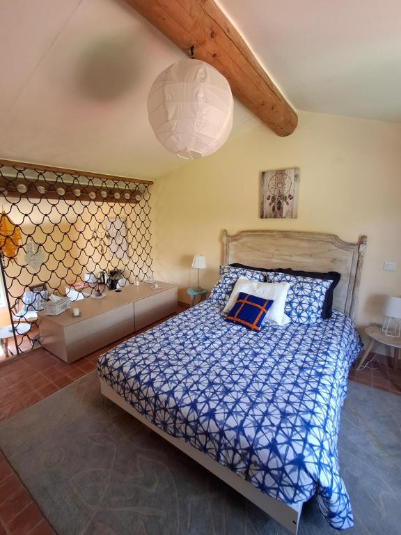 a bedroom with a bed and a tub in it at Casa Doudou in Bédoin