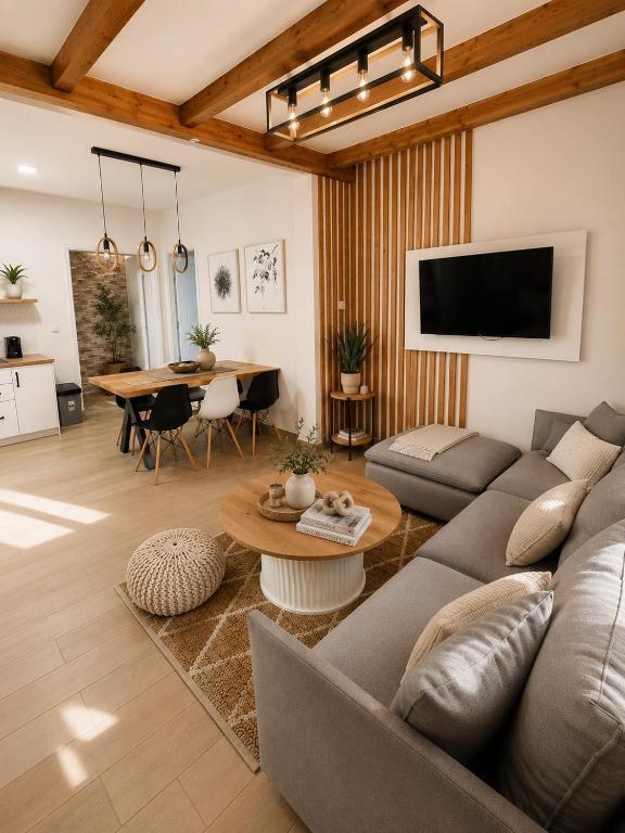 a living room with a couch and a table at Euphoria Suites and Studios in Sidari