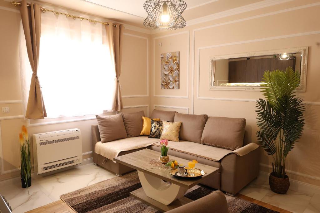 a living room with a couch and a table at Apartman Boki in Bileća