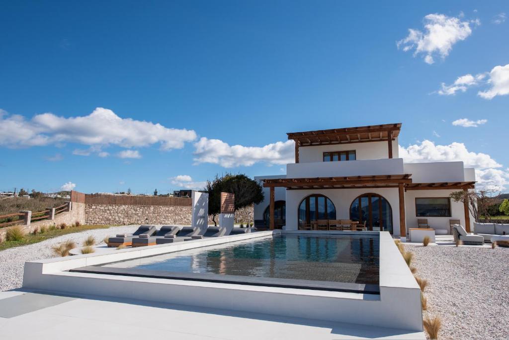 a rendering of a villa with a swimming pool at the shelter - a milos project in Adamantas