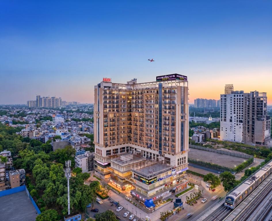 an overhead view of a large building in a city at Hibiscus Elite Hotel in Greater Noida
