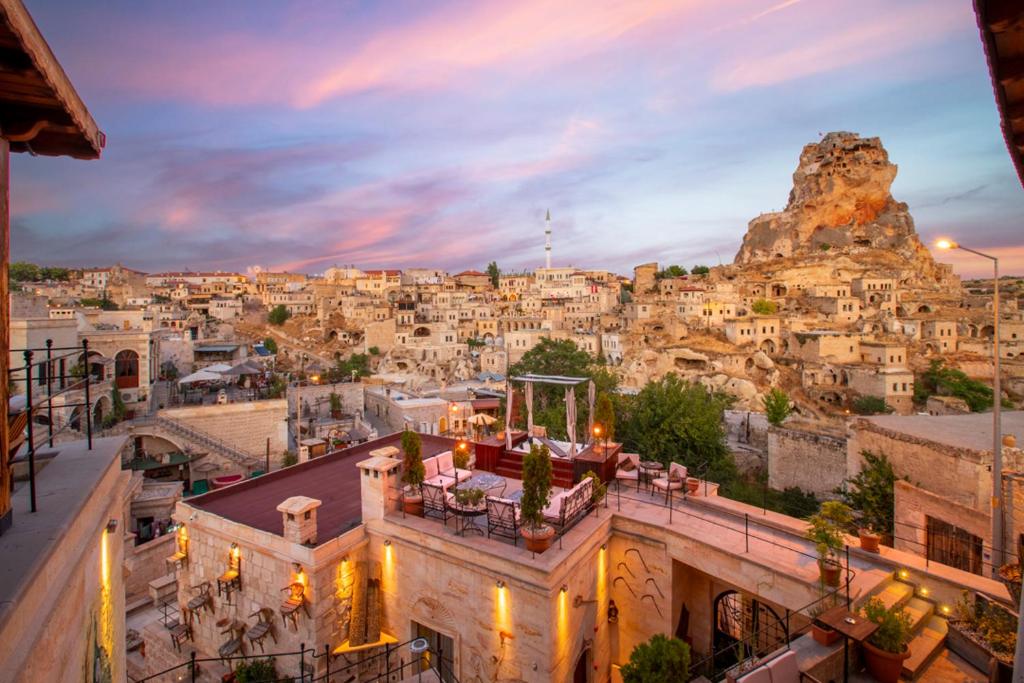 a view of a city at night with a mountain at Cappa Via Cave Hotel in Ürgüp