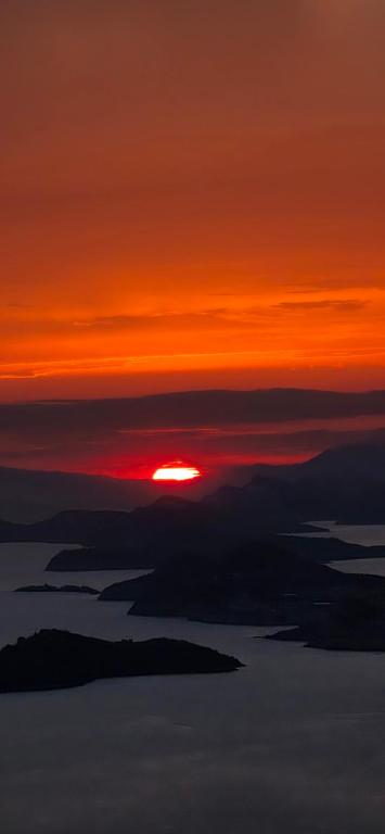 a sunset with the sun rising above the clouds at La Vita Sweet Little House - Mlini in Mlini