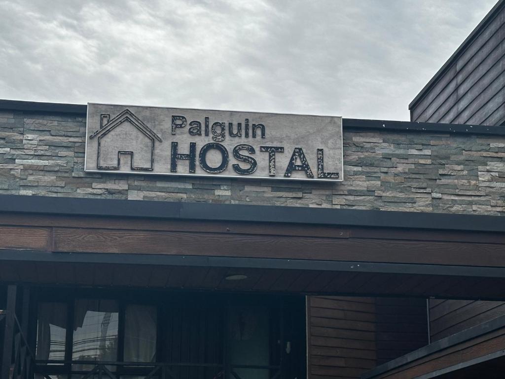 a hospital sign on top of a building at Hostal Palguin 261 in Pucón