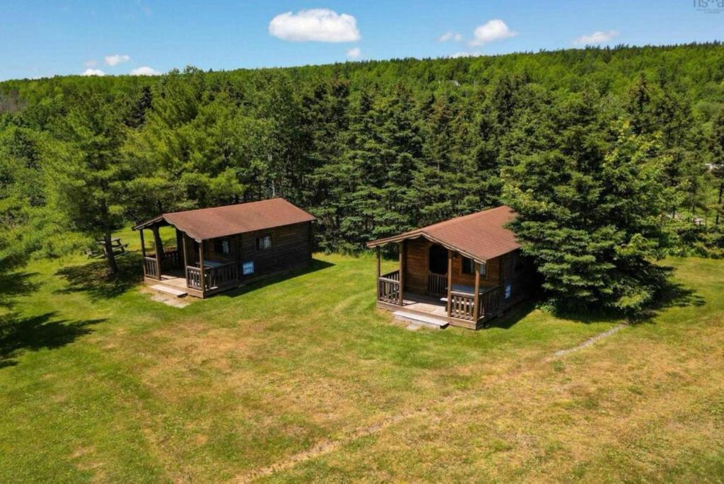 an overhead view of two cottages in a field at Bras D'Or Lakes Campground in Baddeck Inlet