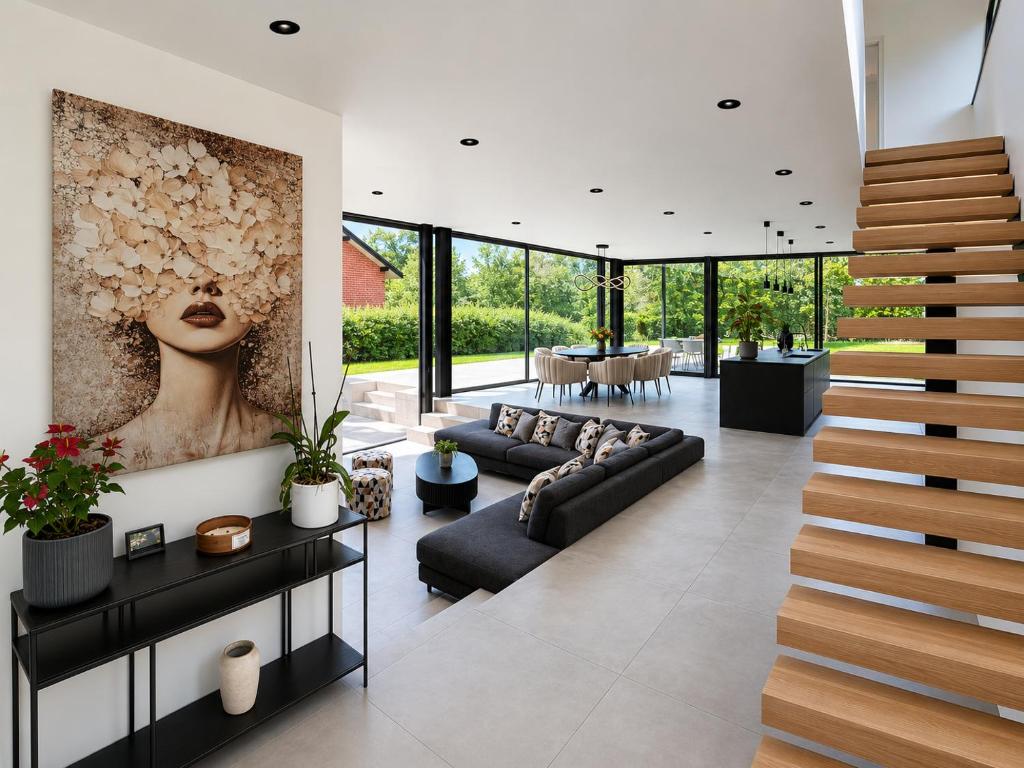 a living room with a staircase in a house at Maison Unifamiliale in Theux