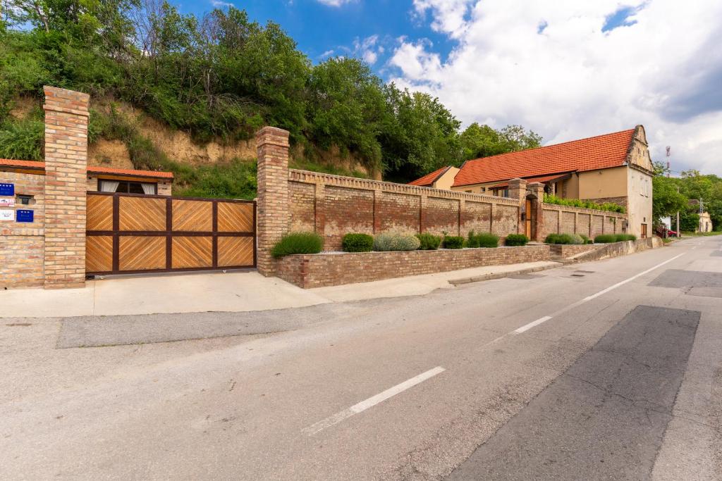 a fence on the side of a road at Bogdanović Winery Apartman in Ilok
