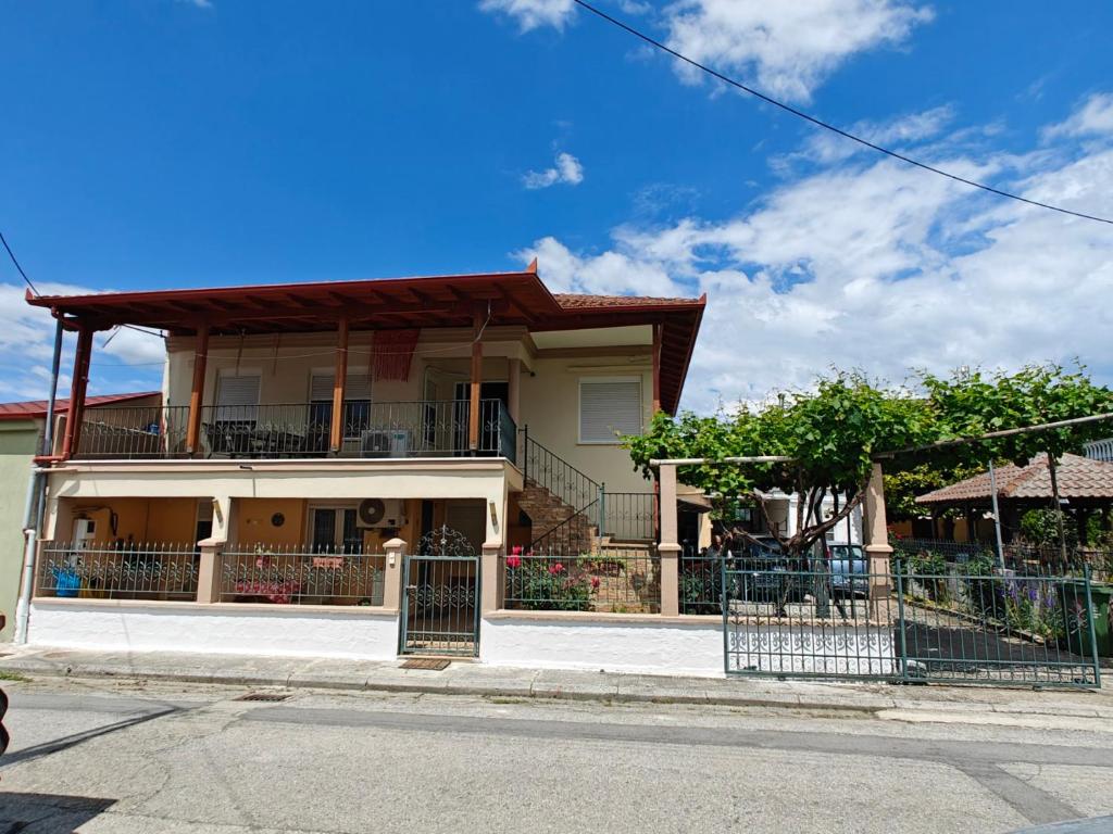 a house on the side of a street at Harys Home in Korinos