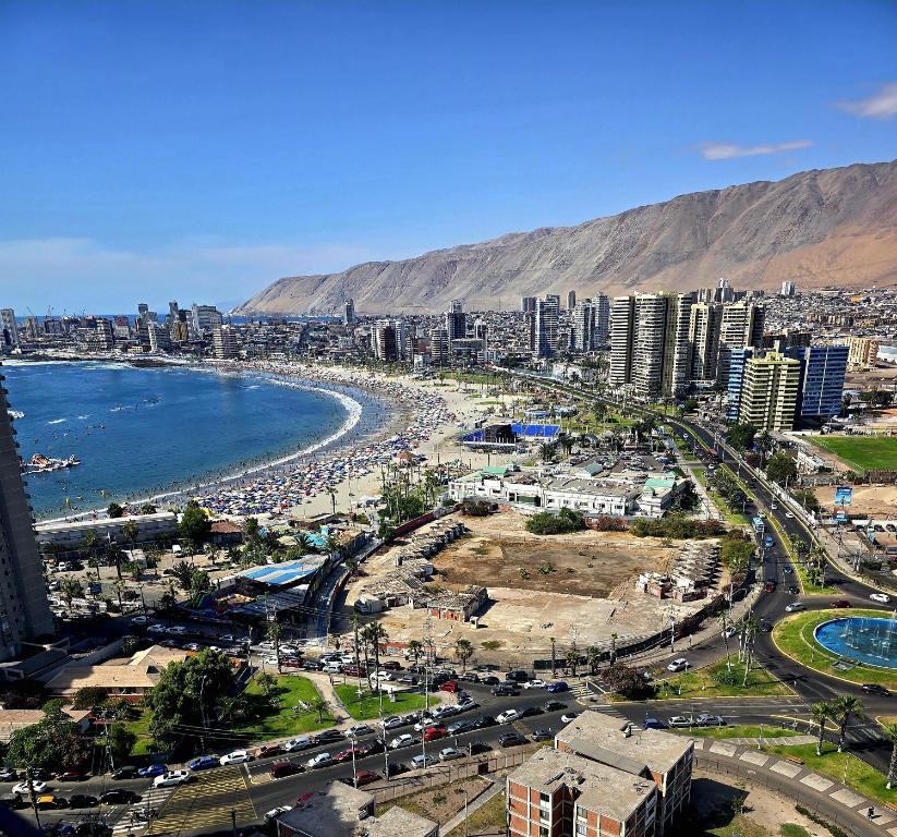 an aerial view of a city with a beach and buildings at PENINSULA DE CAVANCHA, Vista ESPECTACULAR in Iquique