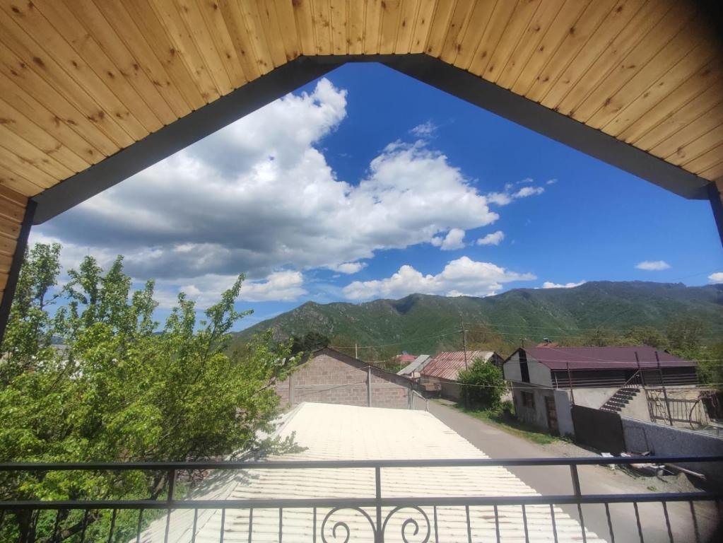 a view of the mountains from the balcony of a house at Eva Guesthouse in Odzun