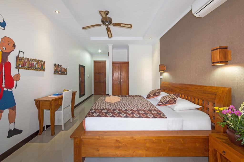 Postel nebo postele na pokoji v ubytování Sandat Bali Ubud