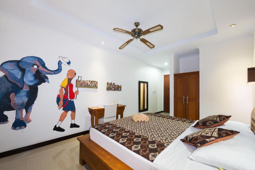 Postel nebo postele na pokoji v ubytování Sandat Bali Ubud