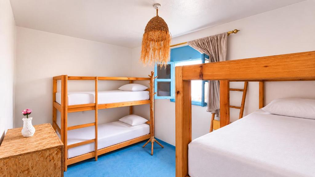 a room with two bunk beds and a bed at Coast anza house in Agadir
