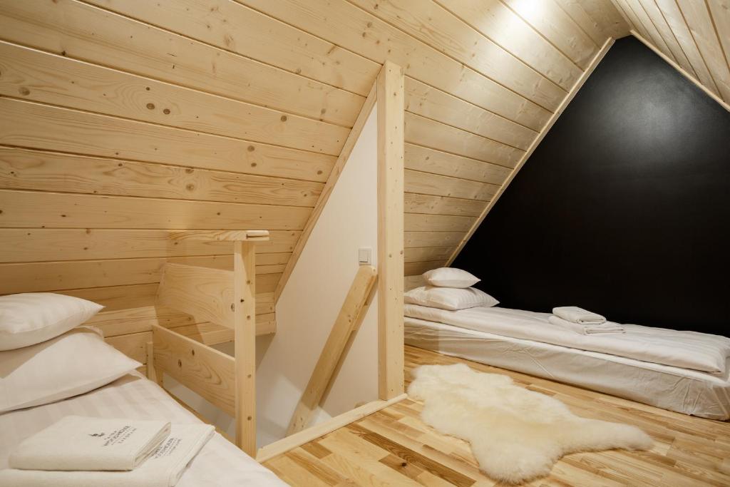 Posteľ alebo postele v izbe v ubytovaní Tatra Wood House
