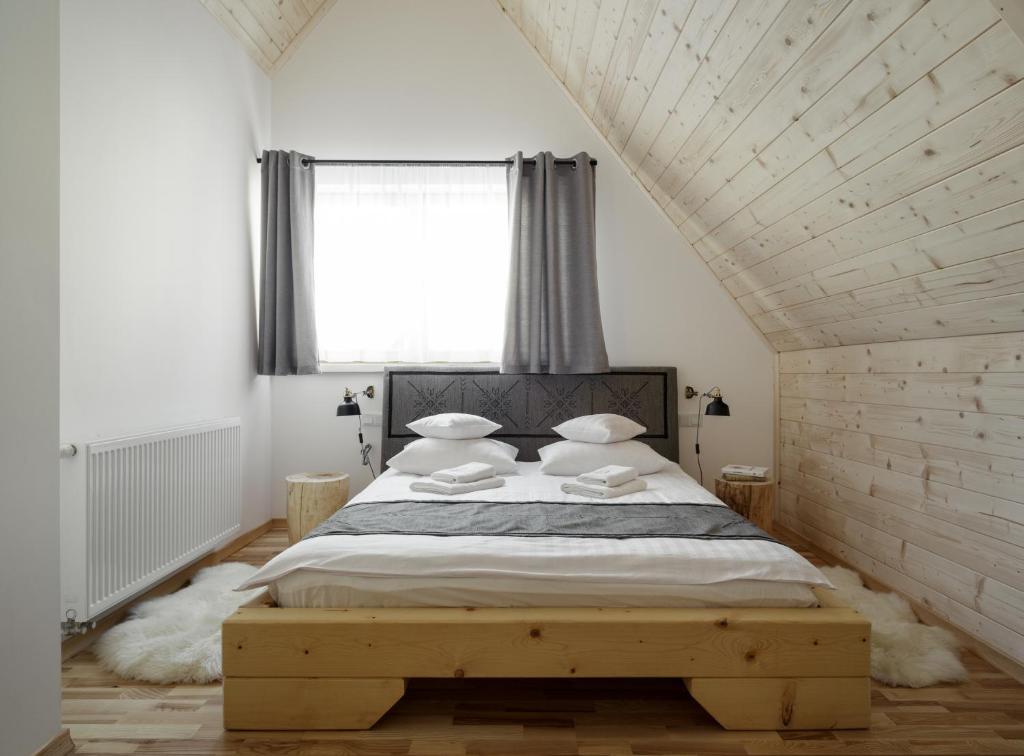 Posteľ alebo postele v izbe v ubytovaní Tatra Wood House