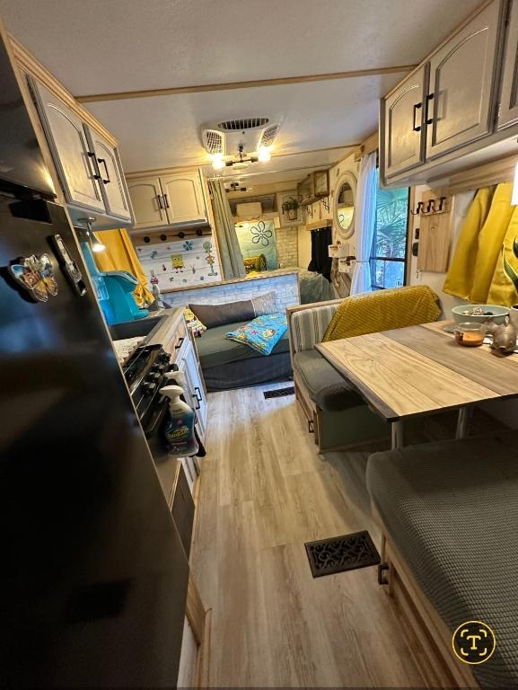 a living room and kitchen of a recreational vehicle at SpongeBob SquarePants on the River in Bullhead City