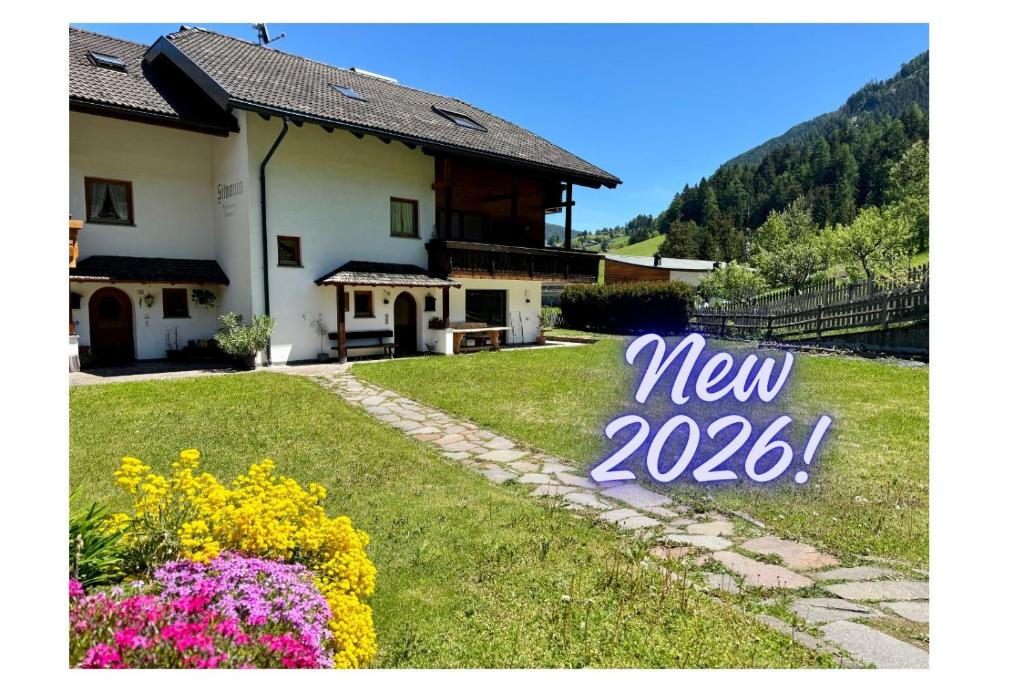a house with a new sign in the yard at Apartments Silvonia in Pallua