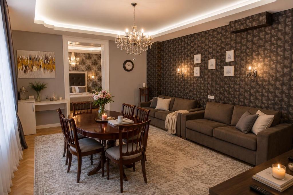 a living room with a couch and a table at Mozart & Bach Historic Apartment in Sibiu