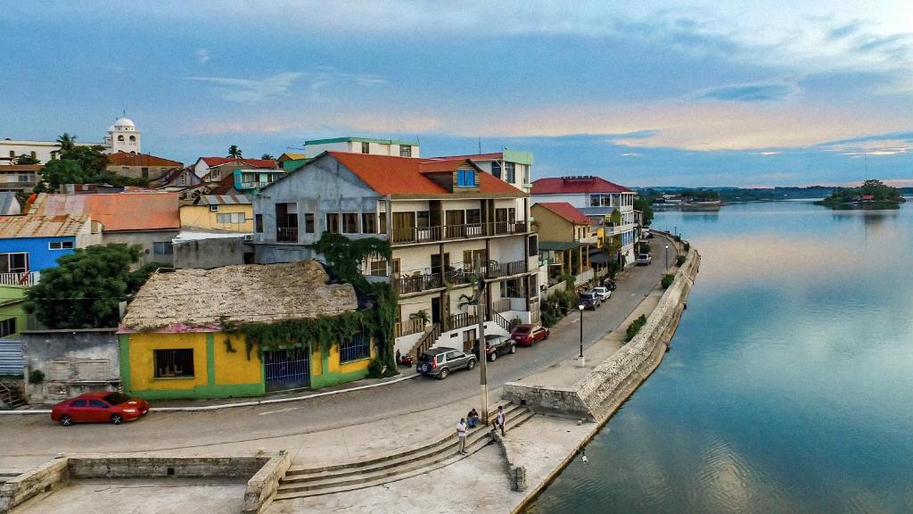 a group of buildings next to a body of water at La Posada De Don Jose in Flores