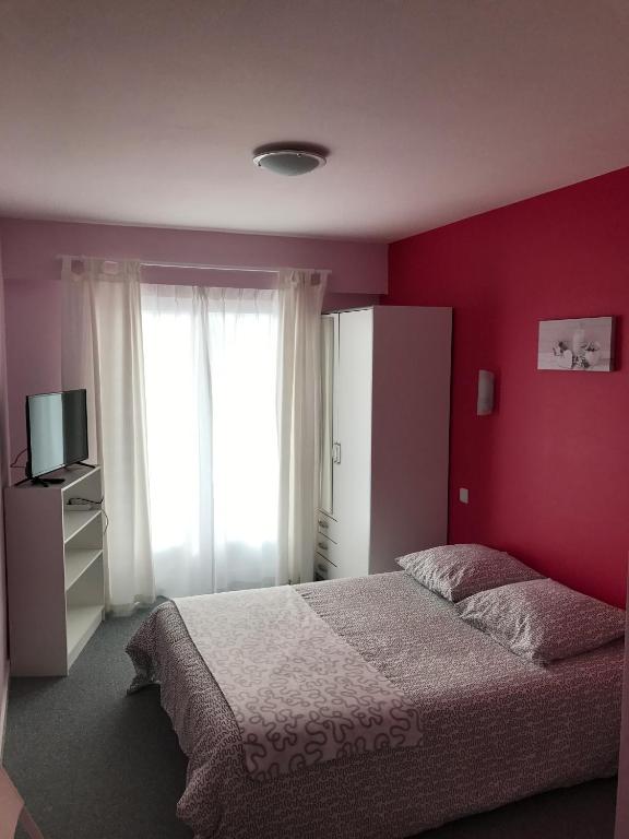 Postel nebo postele na pokoji v ubytování Hôtel du Littoral