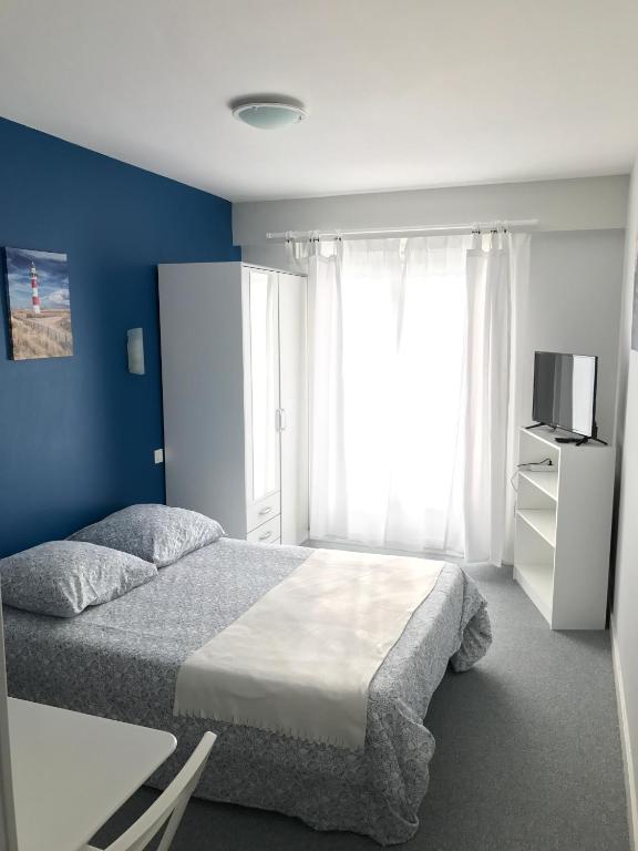Postel nebo postele na pokoji v ubytování Hôtel du Littoral