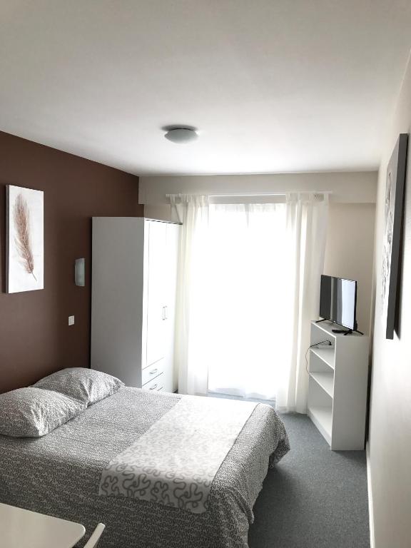 Postel nebo postele na pokoji v ubytování Hôtel du Littoral