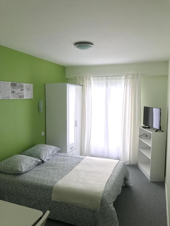 Postel nebo postele na pokoji v ubytování Hôtel du Littoral