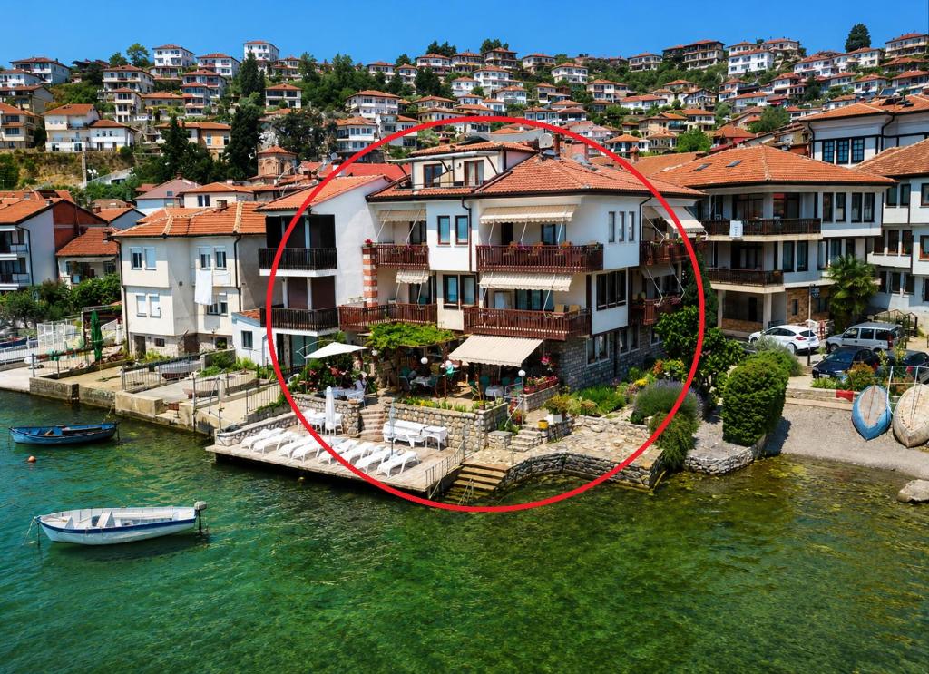 an aerial view of a house on the water at Villa Lucija in Ohrid