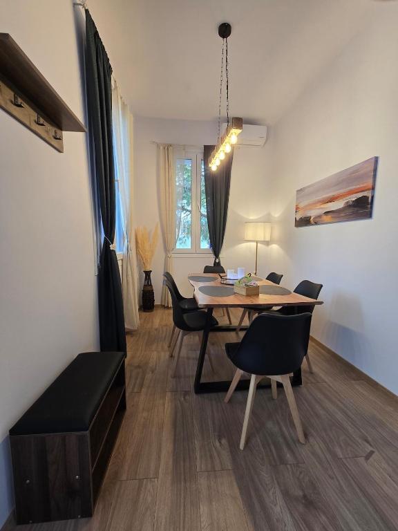 a dining room with a table and chairs at Stone House with Panoramic Views in Marmaro in Mármaron