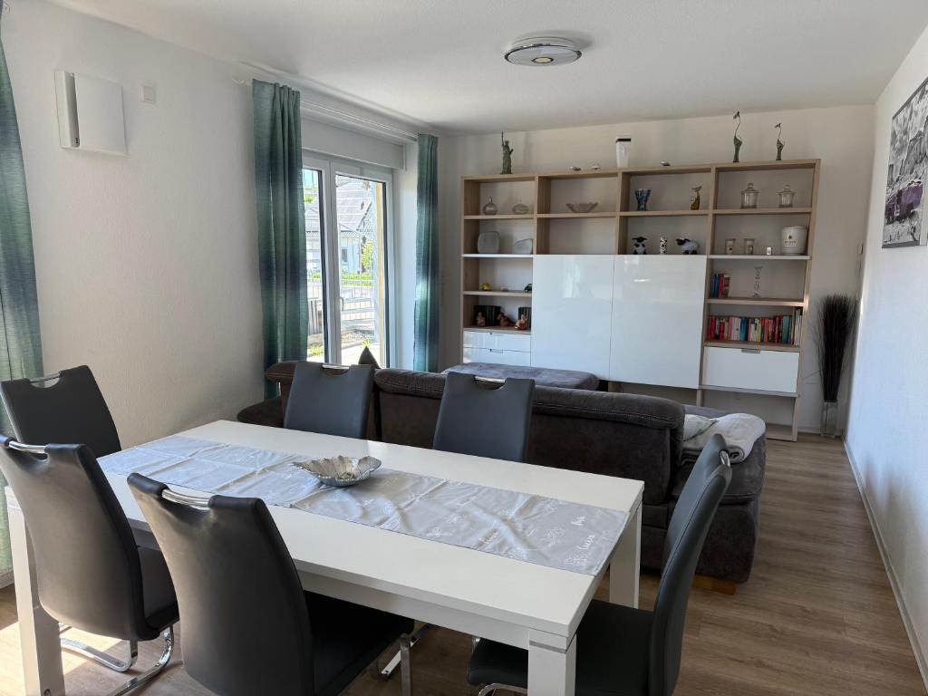 a living room with a table and a couch at Kornspeicher in Nörten-Hardenberg