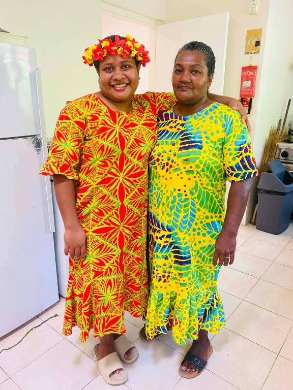 a couple of people standing next to each other at New Mavida Lodge in Levuka