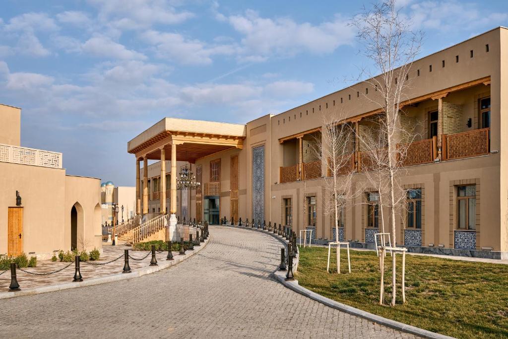 a building with a walkway in front of it at Arda Turan in Khiva