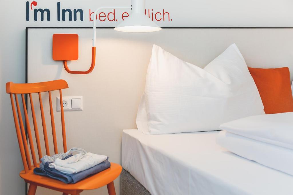 Postel nebo postele na pokoji v ubytování I´m Inn Wieselburg