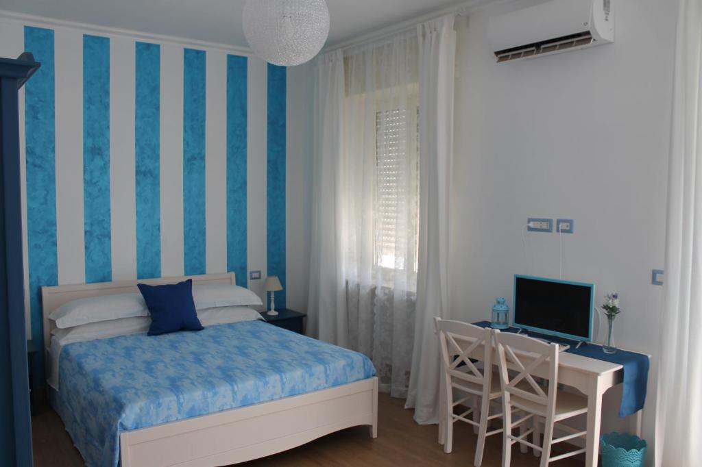 Postel nebo postele na pokoji v ubytování B&B Una Rotonda sul mare