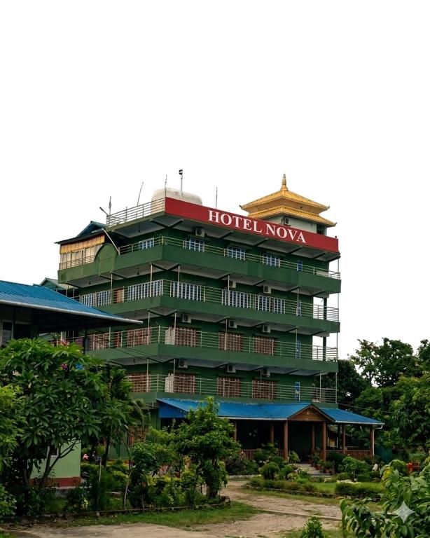 a hotel novo with a sign on top of it at Hotel Nova in Itahari