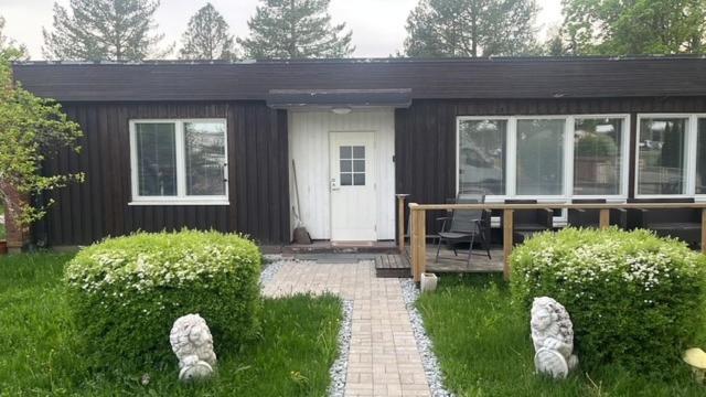 a small house with a porch and a patio at Sweet House with Sauna in Lieto