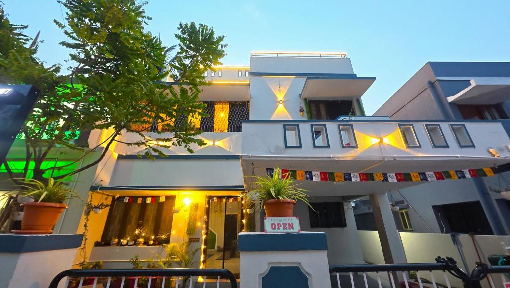 a building with a banner in front of it at Deodar Commune in Visakhapatnam