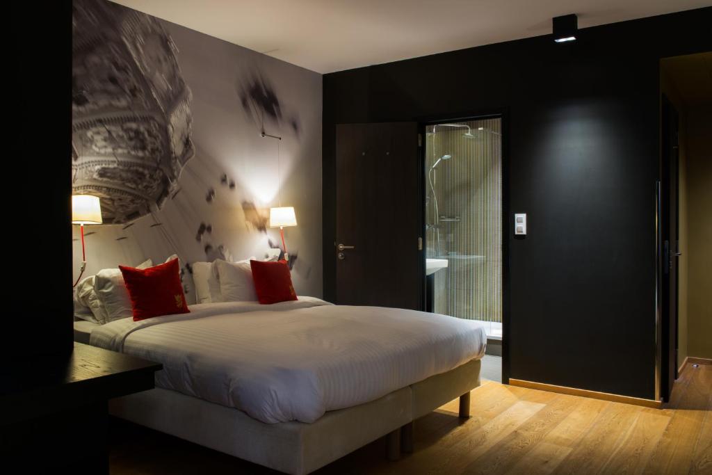Postel nebo postele na pokoji v ubytování Hotel The Royal Snail