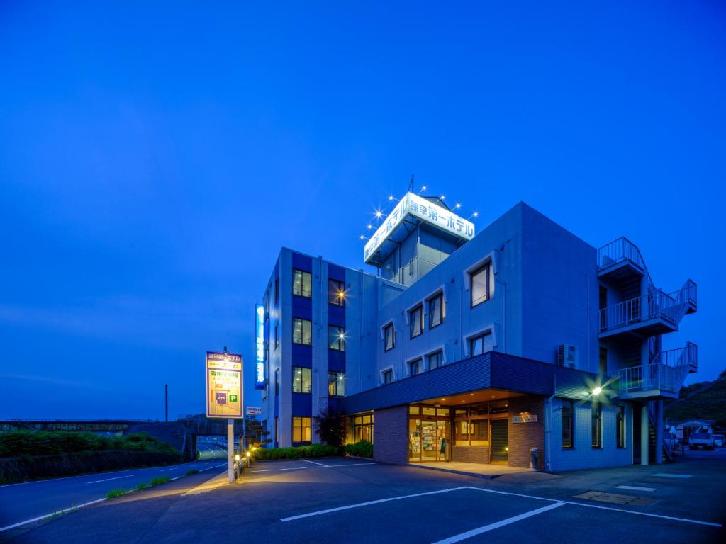 a building with a sign on top of it at Isahaya Daiichi Hotel in Isahaya
