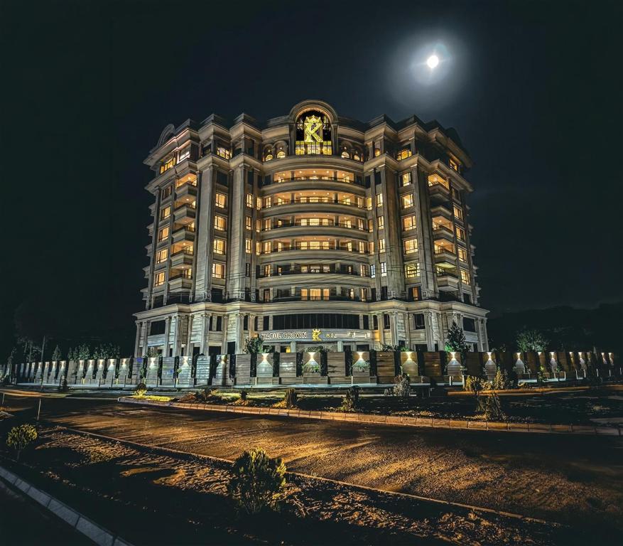 a large building with a clock on it at night at Royal Delegation Suite in Kabul