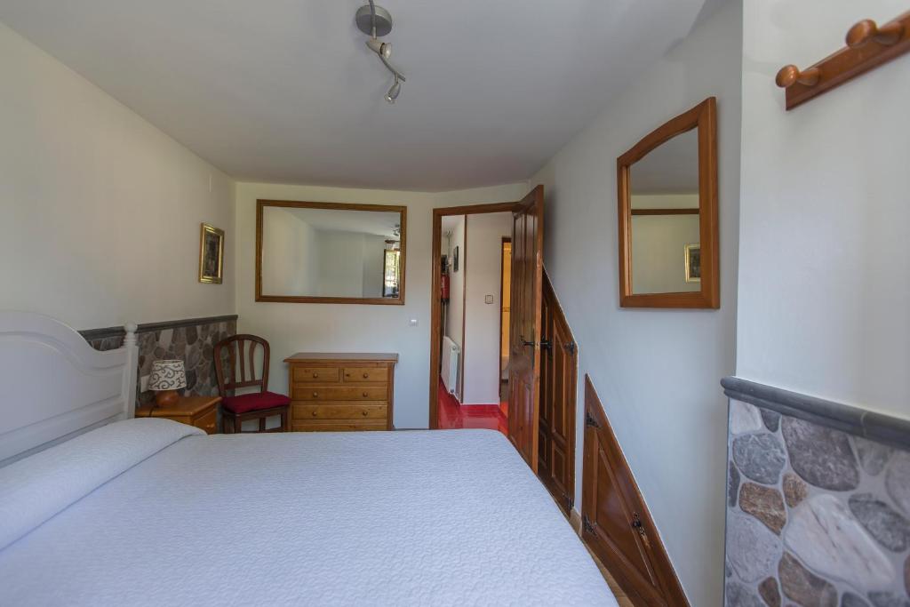 A bed or beds in a room at Apartamentos Rurales Playa del Canal