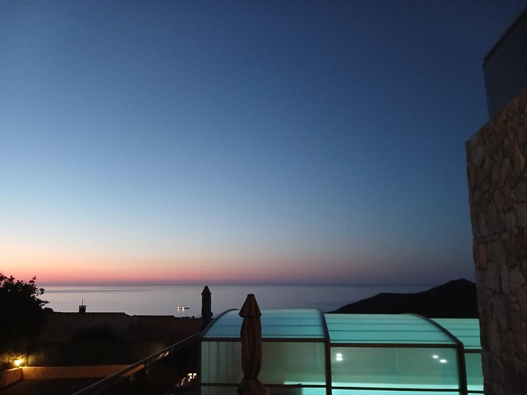 a view of the ocean at sunset from a building at Domaine La Chiusella in Monticello