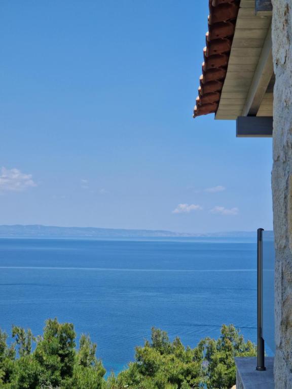 a view of the ocean from a house at nafsea in Afitos