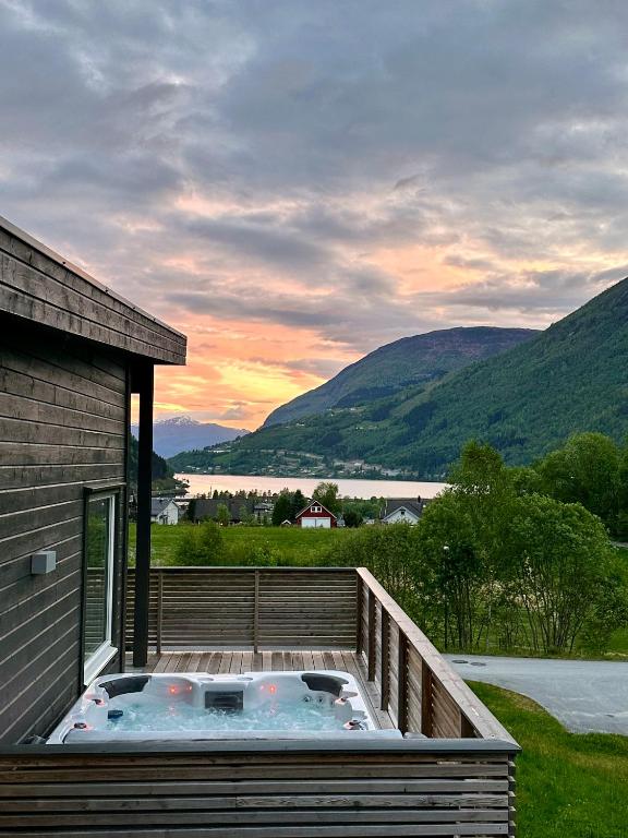 a hot tub on the deck of a house at Loen Panorama in Stryn